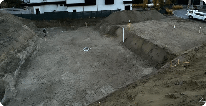 A construction site showcasing dirt and sand, highlighting civil excavation and digging activities in progress